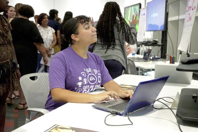 PHOTO/CURLEY AND PYNN Harmony High School's Eilana Santiago works on a problem at the Get in the Game Camp, held by video game producer Electronic Arts exclusively for high school females this summer.