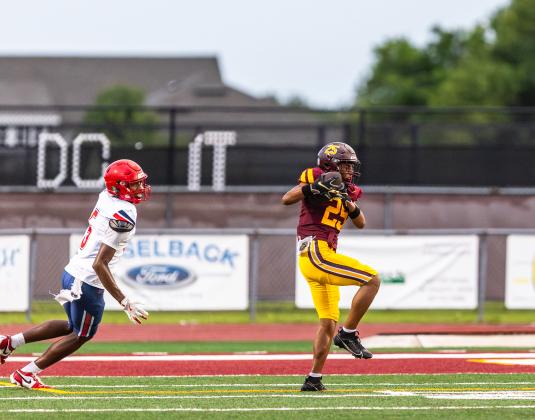 St. Cloud’s Marshall Carter steps in front of Poinciana receiver  Javonte Simpson-Lee for an interception Friday. PHOTO/TAYLOR MCFEE