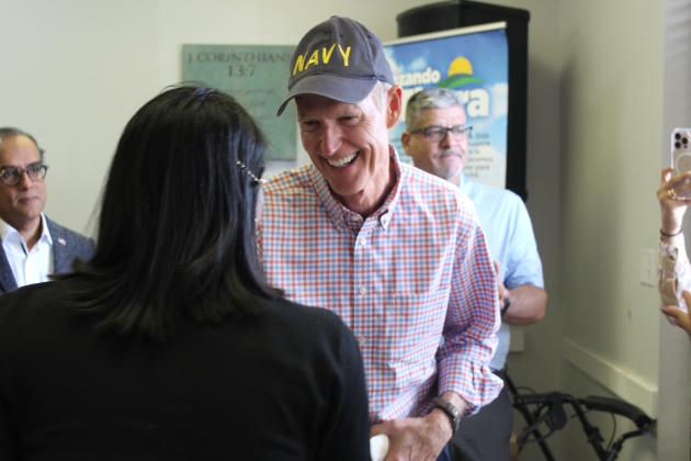 Sen. Rick Scott greets those at Advance Community Center Thursday. PHOTO/KEN JACKSON