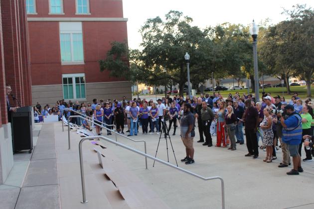Osceola Clerk of Court Kelvin Soto speaks during Thursday's domestic violence awareness rally, which began on the Courthouse steps. PHOTO/KEN JACKSON