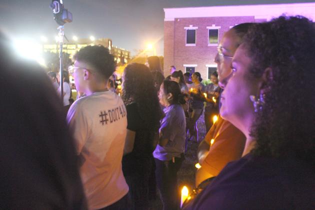 The victims of domestic violence were remembered at the candlelight portion of Thursday's procession, outside of the Kissimmee Police Department. PHOTO/KEN JACKSON