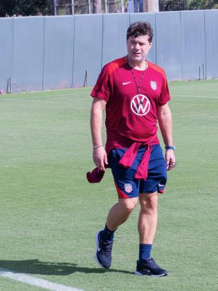 Mauricio Pochettino walking on to the Osceola Heritage Park to lead the practice. PHOTO/MARIO CASAMALHUAPA