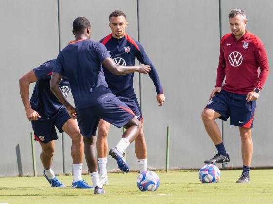 Antonee Robison is waiting for a pass from Timothy Weah as they warm up for a closed door practice. PHOTO/MARIO CASAMALHUAPA