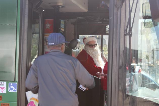 Santa—a.k.a. LYNX bus driver Edwin Cartagena—made some riders’ day. Those who rode on his Monday routes through Kissimmee and St. Cloud got a free ride. PHOTO/KEN JACKSON