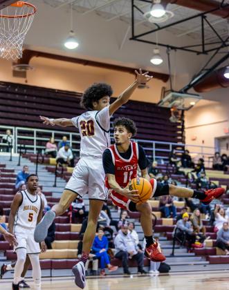 Gateway's Yangel Malpica drives to the lane while St. Cloud's Malaki Baker defends. PHOTO/TAYLOR MCFEE