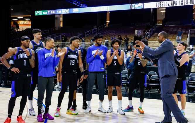 The Magic accept the NBA G League Eastern Conference championship trophy after Sunday's win. PHOTO/TAYLOR MCFEE