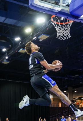 After getting a steal and a breakaway, Osceola's Jalen Slawson throws down a reverse slam for two of his 14 points in Tuesday's win over the Stockton Kings. PHOTO/TAYLOR MCFEE