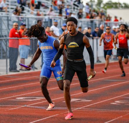 Liberty's Alverez Toussaint crossed the line first to claim the 4x100 relay for the Chargers. PHOTO/TAYLOR MCFEE