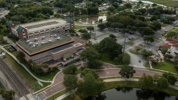 The city of Kissimmee now have final agreement with Azure Hotel International to build a 300-room hotel on the site of the current Civic Center, and a new convention center on the current parking lot.  The SunRail parking garage (at top) will remain. (Photo/City of Kissimmee)