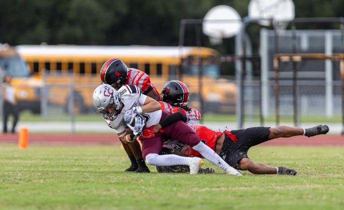 Thou shalt not pass — Gateway's Dylan Dingle (0) and Nathaniel Cadogan (6) team up to stop a Cypress Creek ballcarrier Friday. (Photo/Taylor McFee)