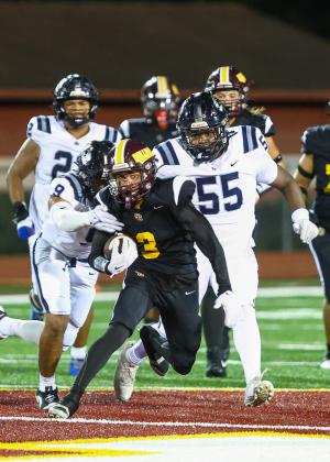 Stacy Taylor, who caught four passes for 47 yards, fights to get upfield against the Lake Nona defense in the Bulldogs' 25-17 win Friday. (Photo/Taylor McFee)