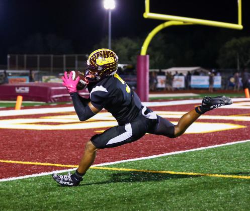 Bryce Williams, who also had an interception and three punts that put Lake Nona in tough field position, also made this diving touchdown catch, a 22-yarder from Jeremiah Lattier. (Photo/Taylor McFee)