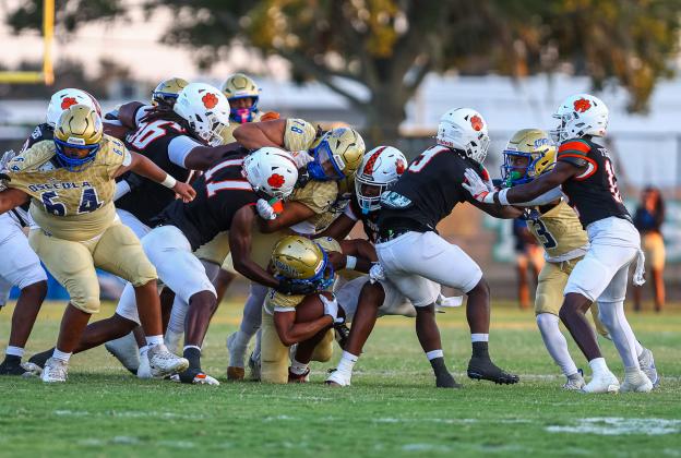 The yards came tough for Osceola run game against Jones. The Kowboys' Jaxson Hardnett ends up on the bottom of the pile on this short run in Friday's 28-14 Tigers win. (Photo/Taylor McFee)