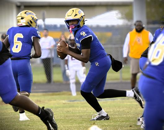 Osceola quarterback Amaree Rutland looks for a receiver in Friday's 44-7 victory over St. Cloud. (Photo/Katie Williams)