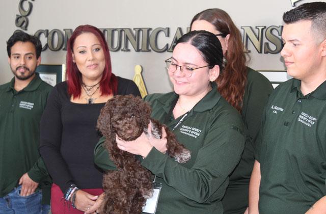 The Osceola County Sheriff’s communications team introduces its newest co-worker, therapy dog Echo. (Photo/Ken Jackson)
