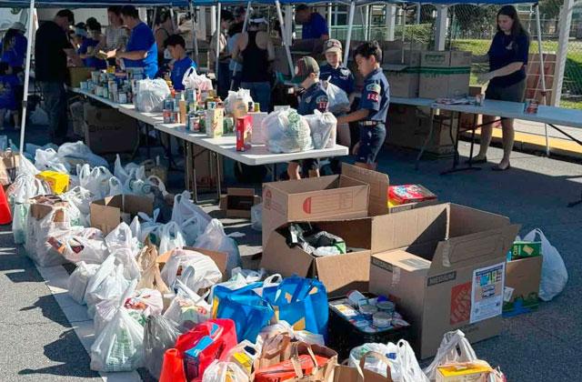 Scouting American Pack 125 collected donations Saturday from Osceola County residents as part of the annual Scouting for Food campaign to benefit the Basket Brigade. (Photo/Greg Filak)