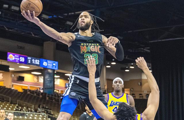 The South Bay Lakers' Zach Hicks is no match for the Osceola Magic's Phillip Wheeler as he drives to the hoop in the Magic's 137-133 win Monday, extending Osceola's win streak to five games. (Photo/Taylor McFee)