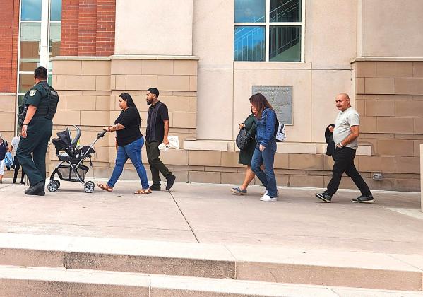 Members of the Hernandez family leave the courthouse Wednesday without comment following the sentencing of Richard Ferguson, who was found guilty of manslaughter and sentenced to 37 years in prison, as prosecutors say culpably negligent in allowing his unlicensed son to drive a family car and kill their mother and children in a September 2023 crash. (Photo/Ken Jackson)