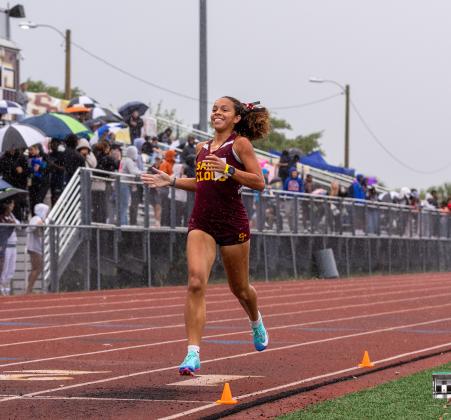 When it rains, Kyla reigns: St. Cloud's Kyla Perez put on a show Wednesday, winning the 800, 1600 and 3200 meter runs and running a leg on the winning 4x800 relay team.  (Photo/Taylor McFee)