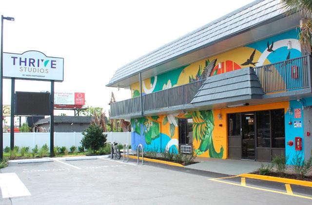 The design of Thrive Studios comes with a logo designed by the digital design program at Tohopekaliga High School and junior Alyson Melo, placed prominently on the studios’ sign for the thousands of drivers on U.S. 192 to see, and a colorful mural part of Osceola Arts’ ARTisNOW program by local artist Sabrina Dessalines. (Photo/Ken Jackson)