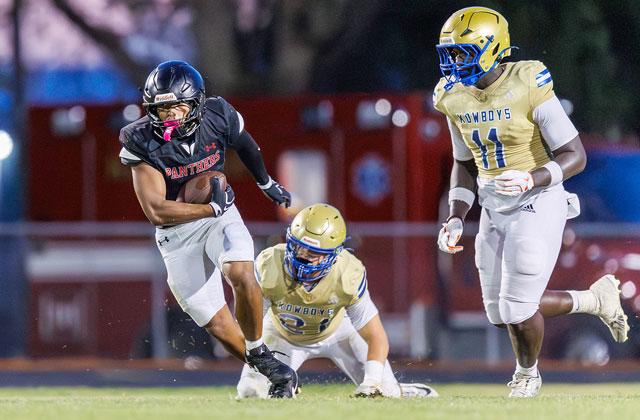 Osceola defenders Jason Lewis (11) and Colton Carter (21) try to bring down Gateway’s Honor Kim in Friday’s spring football jamboree. (Photo/Taylor McFee)