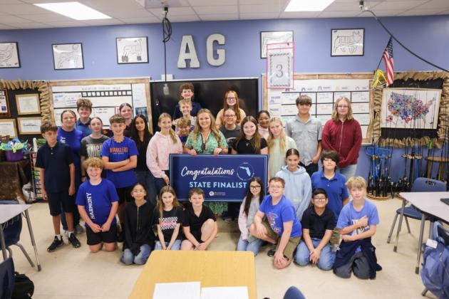 Harmony Middle School agriculture teacher and 2027 Florida Teacher of the Year finalist Kyndall Brown with her students. (Photo/Florida Department of Education)