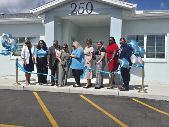 City, County, State and Osceola Council on Aging officials cut the ribbon Friday at the Buen Vecino senior affordable living community in Buenaventura Lakes. (Photo/Ken Jackson)