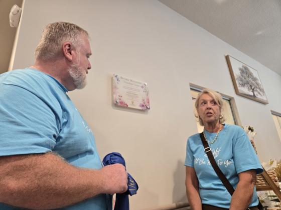 The Buen Vencino community space was dedicated to former OCOA President Beverly Hougland. Her children Warren and Christin helped dedicated a plaque in her honor. (Photo/Ken Jackson)
