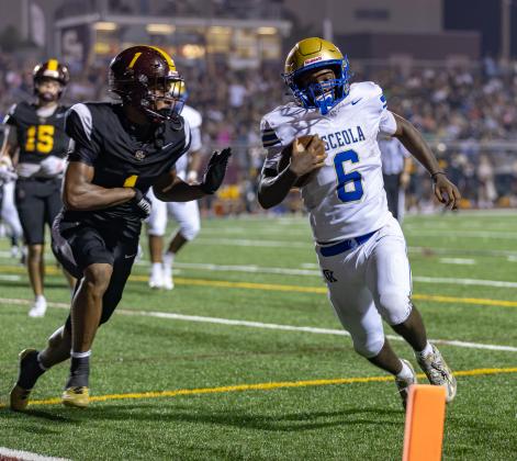Osceola's Zylin Garrett. shown in last week's game against St. Cloud, scored in a wild sequence of the second quarter Friday to help the Kowboys take a 28-0 halftime lead en route to a 34-7 win over Poinciana. (Photo/Taylor McFee)