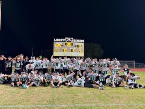 The Nova Lakes Rattlers celebrate their first-ever football victory, a 25-0 win Friday over Liberty. (Photo/Michelle Kostuch)