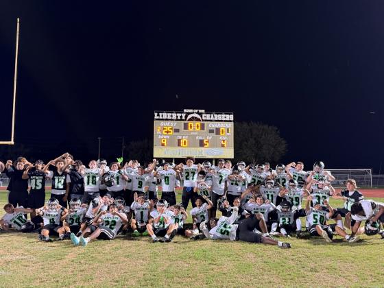 The Nova Lakes Rattlers celebrate their first-ever football victory, a 25-0 win Friday over Liberty. (Photo/Michelle Kostuch)