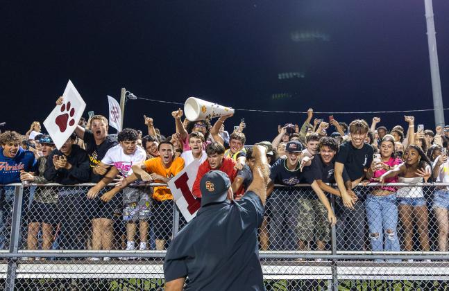 Bulldogs Mike Short celebrates with the crowd after Friday's win. (Photo/Taylor McFee)