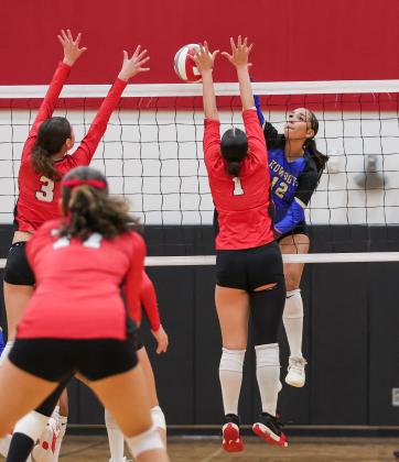 Osceola's Leah Nieves hits through a front line of Gateway's Gabriella Herrera (1) and Cristabella Santiago (3) in Thursday's win. (Photo/Taylor McFee)