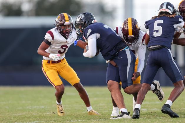 St. Cloud's Stacy Taylor-Irons closes in on Lake Nona quarterback Elijah Nickerson in Friday's 43-8 Lions win. (Photo/Taylor McFee)