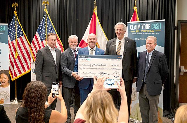Florida CFO Blaise Ingoglia presented a check for $41,716 in unclaimed funds to the University of Central Florida on Sept. 15. The state was holding it, and returned it through the Claim Your Cash Florida program. (Photo/ Florida CFO Blaise Ingoglia)