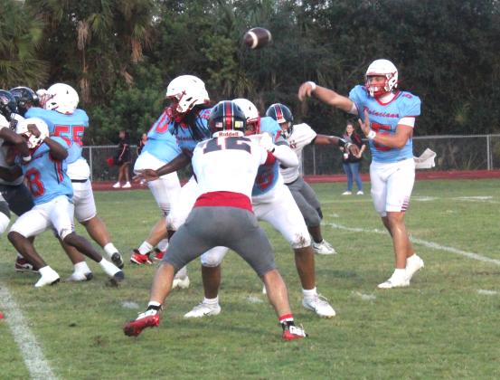 Poinciana quarterback Lucas Minenok threw for 107 yards and a score Friday as he worked to keep the Eagles in the game. (Photo/Ken Jackson)