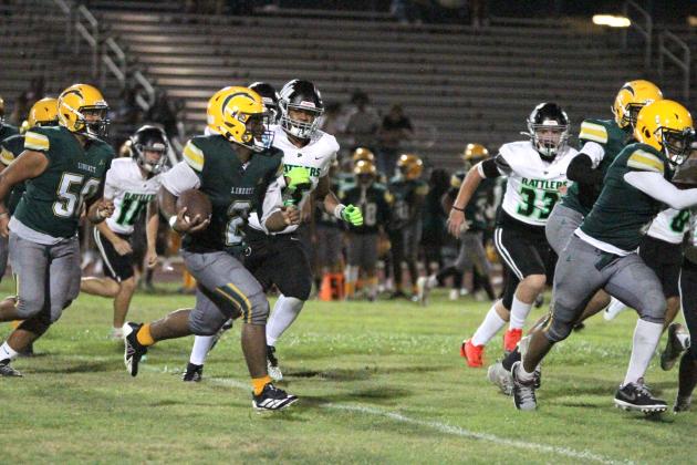 Liberty’s Ayomide Akinwole, shown here in last week's game against Nova Lakes, scored the Chargers' first points of 2026 with on a 10-yard run against Discovery Friday. (Photo/Michelle Kostuch)