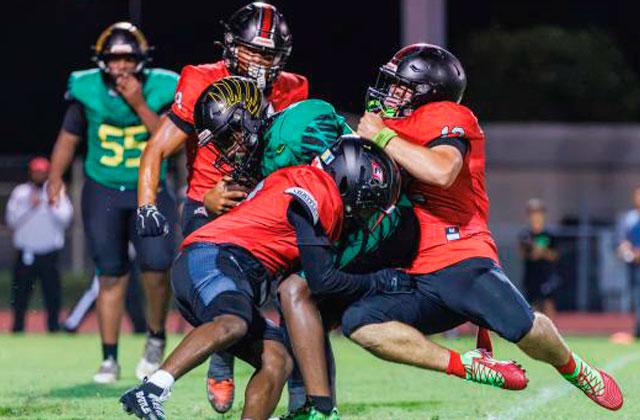 Gateway’s Nydrell Thigpen rushed for 158 yards—some harder than others, like on this run—ran for a touchdown and set up another in the Panthers’ 13-12 season-opening victory Friday against Lake Minneola. (Photo/Taylor McFee)