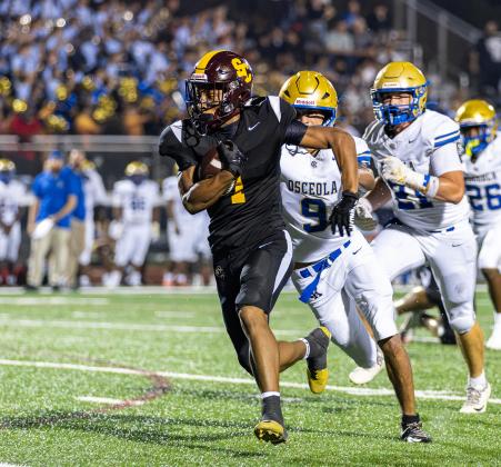 Jaden Taylor-Irons, shown here in the season-opening win over Osceola, set up St. Cloud's second touchdown Friday with an interception before going down with a leg injury. (Photo/Taylor McFee)
