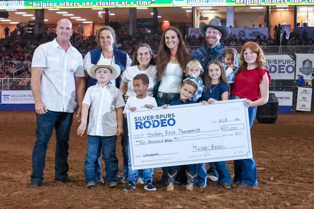 During the rodeo the Silver Spurs Riding Club presented a $10,000 donation to Safety First Pediaquatics of St. Cloud, which specializes in providing swim lessons to area children, including those with special needs.