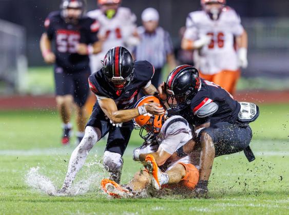 Gateway defenders, like Braylon Rivette (17) and Zedekiah Lester (7) made things difficult for Bradley Weck (2) and the rest of the Tohopekaliga Tigers in a 33-0 Panthers win Friday. (Photo/Taylor McFee)