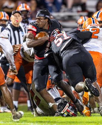 Tohopekaliga came up with a novel way to try to stop Gateway running back Nydrell Thigpen, who still tallied 117 rushing yards Friday: rip his helmet off while Markell Solomon (51) throws a block. (Photo/Taylor McFee)