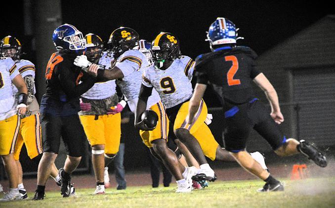 St. Cloud quarterback Jeremiah Lattier's 3-yard touchdown run, his second of the night, with 25 seconds remaining was the difference in a 14-7 win Friday over Harmony. He'll need another solid performance Friday against Lake Howell, a game that could be key to the Bulldogs' playoff hopes. (Photo/Katie Williams)