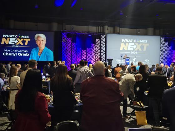 Commissioner Cheryl Grieb received a standing ovation as she took to the podium Wednesday to accept the Commission's annual Person of the Year Award. (Photo/Ken Jackson)