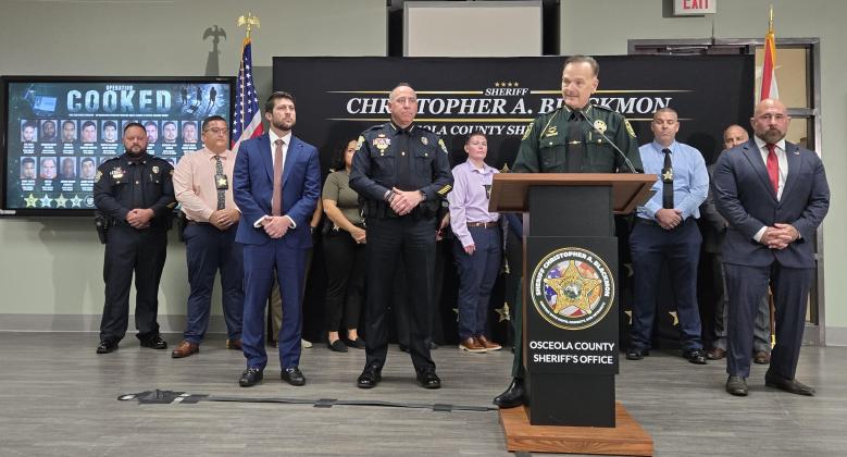 Florida Attorney General James Uthmeier and Lt. Gov. Jay Collins (far right) joined Osceola Sheriff Chris Blackmon (at podium), St. Cloud Police Chief Doug Gierke, representing one of the eight agencies that participated, and members of the Internet Crimes Against Children (ICAC)  division Thursday to announce the 20 arrests. (Photo/Ken Jackson)