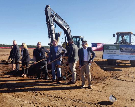 Osceola County Schools and Tavistock officials ceremoniously break ground Monday for Sunbridge’s first school, a K-8 E-STEM model. PHOTO/KEN JACKSON