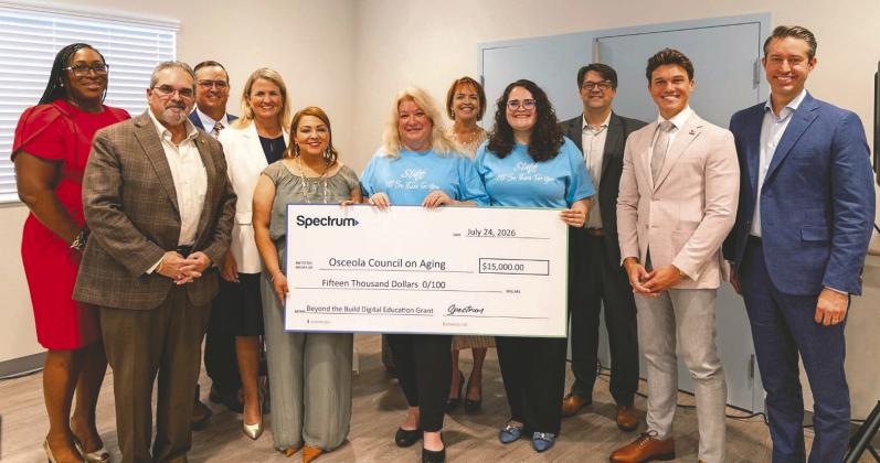 Osceola County, Kissimmee Osceola Council on Aging and Spectrum leaders joined at the Buen Vecino Digital Learning Lab grand opening. (Photo/Osceola Council on Aging)