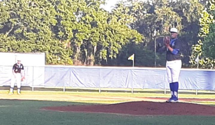 Osceola’s Shawn Lara gets ready to deliver the first pitch of the game in the Class 7A, District 9 NEWS-GAZETTE PHOTO/J. DANIEL PEARSON