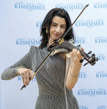 The fiesta in the City Hall foyer featured a stirring performance by renowned recording artist and violinist Imén Nasser.PHOTO/CITY OF KISSIMMEE