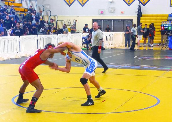 Osceola senior Anderson Heap (white singlet) will look for his third consecutive state championship this year PHOTO/DAN PEARSON